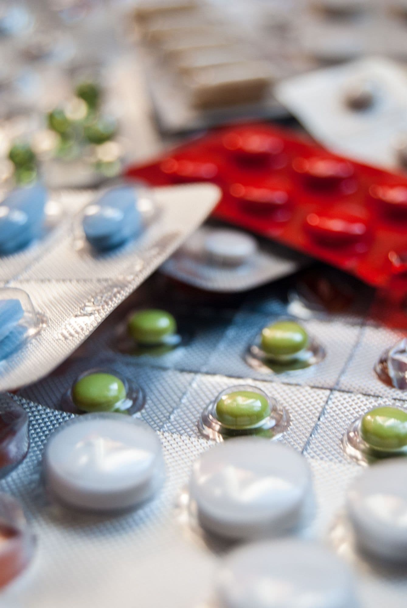 Close-up of assorted tablets in blister packs.